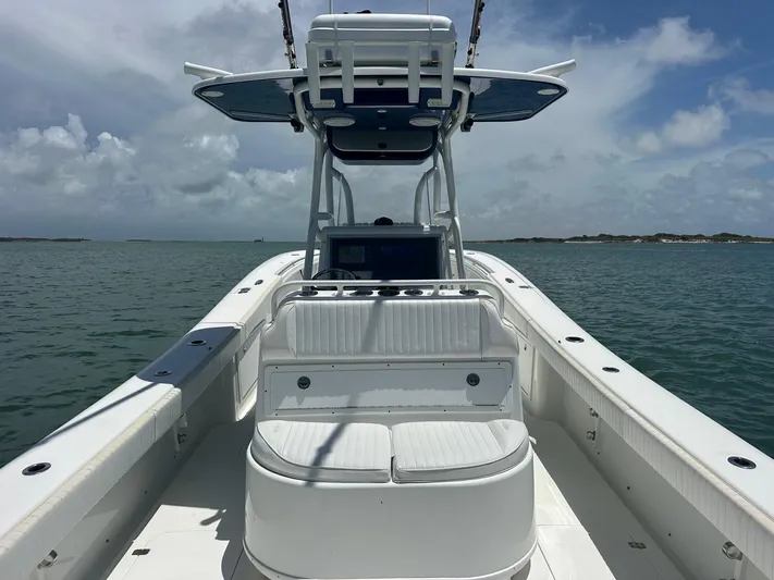  Yacht Photos Pics 2012 Yellowfin 36 Offshore boat on calm water under a cloudy sky.