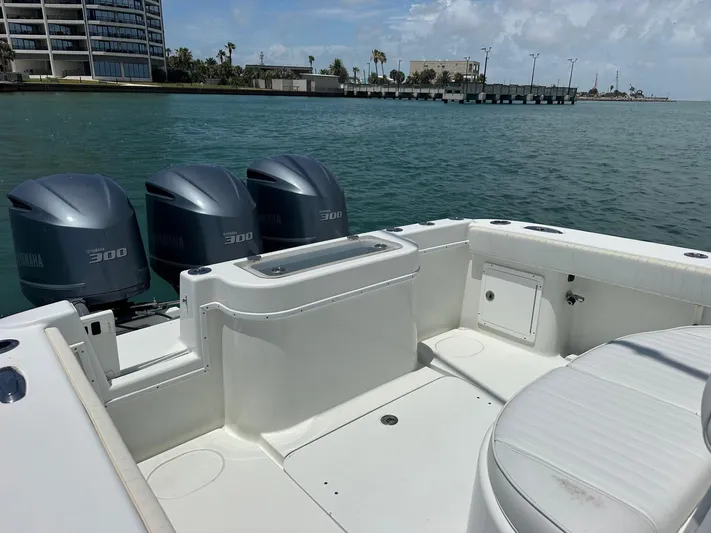  Yacht Photos Pics 2012 Yellowfin 36 Offshore boat with triple Yamaha 300 engines on calm water.