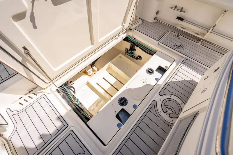 High Voltage Yacht Photos Pics 2013 Boston Whaler 320 Outrage boat deck with open storage compartment.