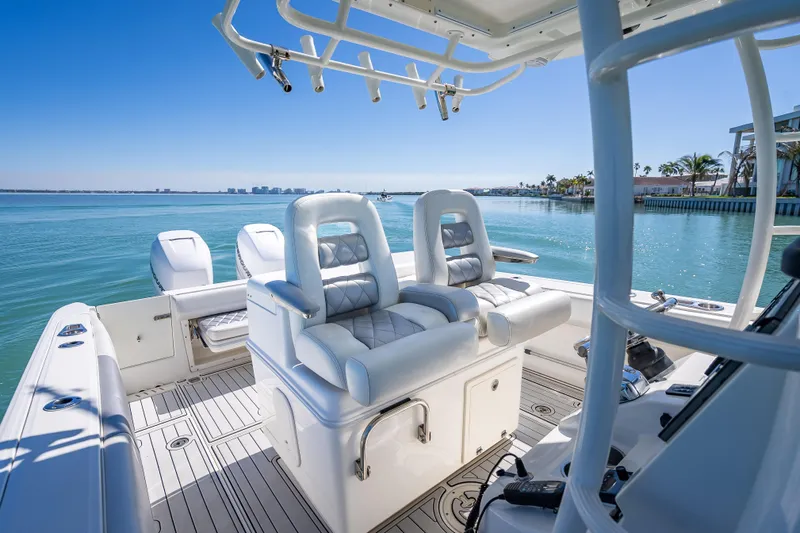 High Voltage Yacht Photos Pics 2013 Boston Whaler 320 Outrage boat interior with luxurious seating and ocean view.
