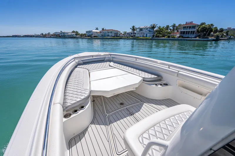 High Voltage Yacht Photos Pics 2013 Boston Whaler 320 Outrage boat interior with luxurious seating and ocean view.