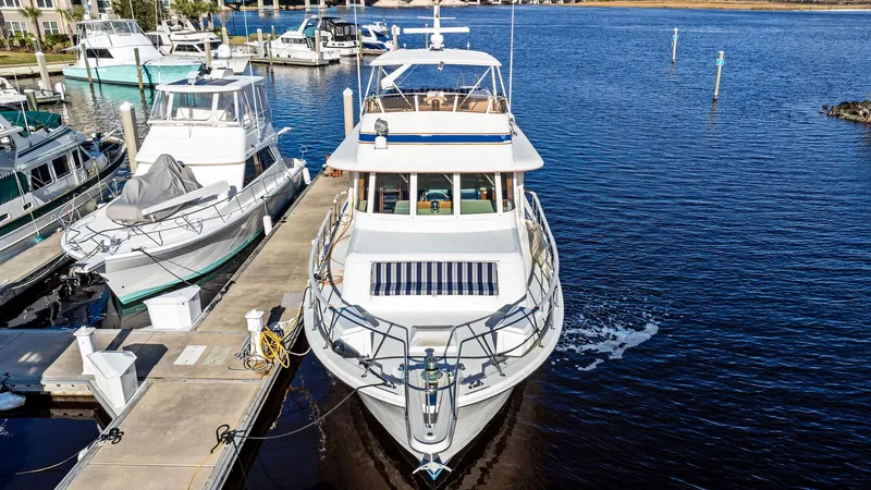 Airwaves Yacht Photos Pics 1987 Hatteras 68 Cockpit Motor Yacht docked at marina, front view.