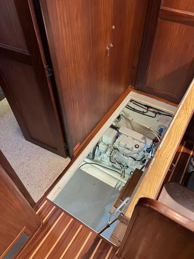 Airwaves Yacht Photos Pics Engine compartment of 1987 Hatteras 68 Cockpit Motor Yacht, wooden interior.