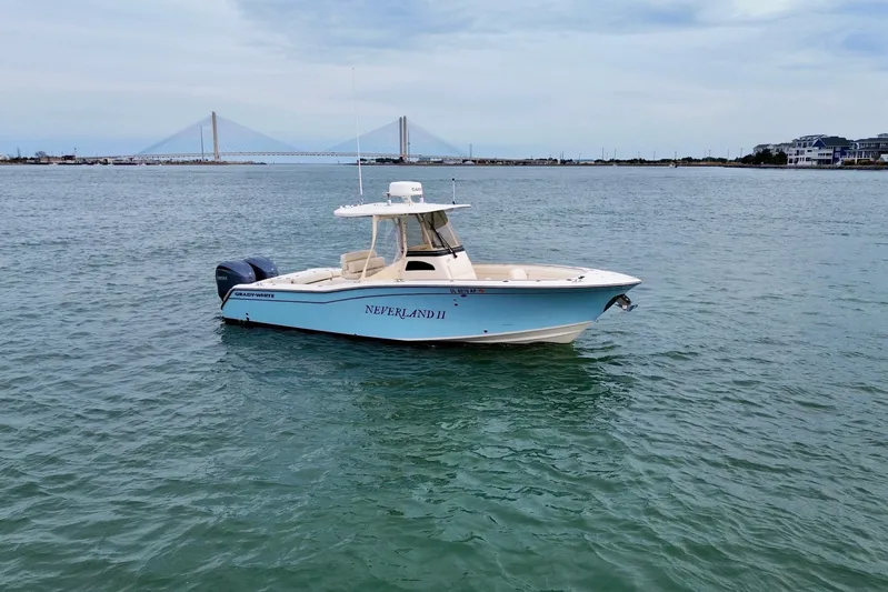 Neverland II Yacht Photos Pics 2022 Grady-White Canyon 271 boat on water with bridge in background.