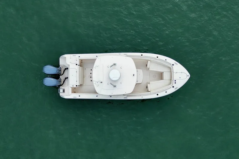 Neverland II Yacht Photos Pics Aerial view of 2022 Grady-White Canyon 271 boat on green water.