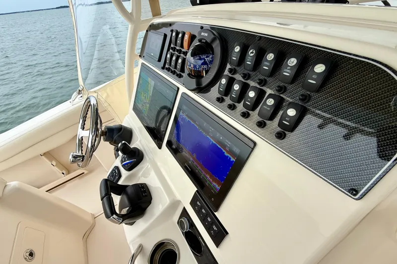 Neverland II Yacht Photos Pics 2022 Grady-White Canyon 271 boat dashboard with advanced navigation controls and displays.