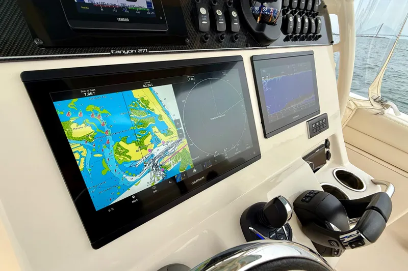 Neverland II Yacht Photos Pics 2022 Grady-White Canyon 271 boat dashboard with navigation and control systems.