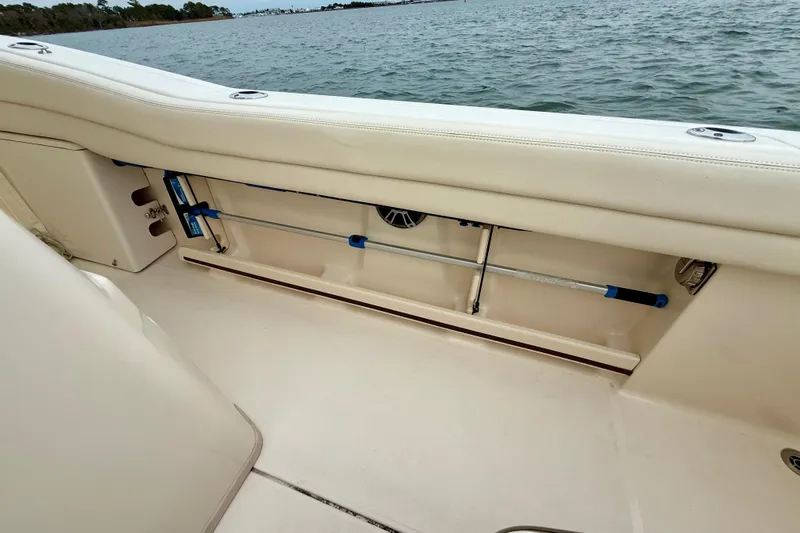 Neverland II Yacht Photos Pics 2022 Grady-White Canyon 271 boat interior with rod storage by the water.