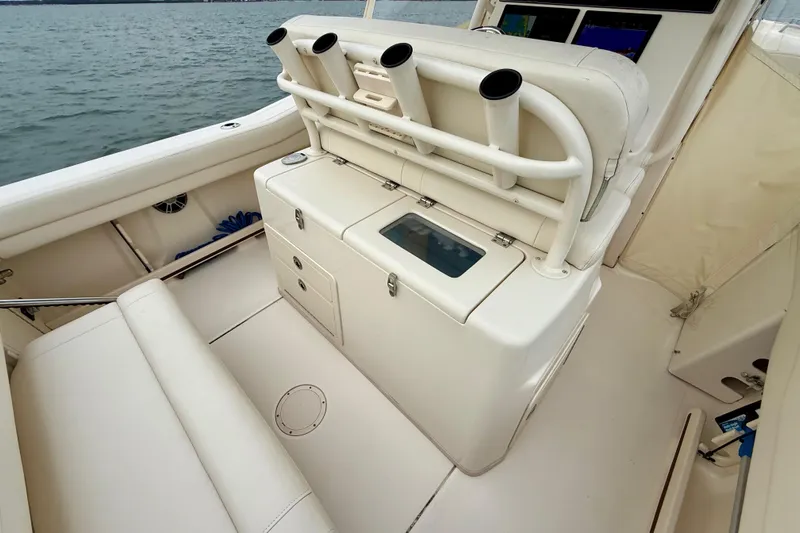 Neverland II Yacht Photos Pics 2022 Grady-White Canyon 271 boat interior with rod holders and seating.