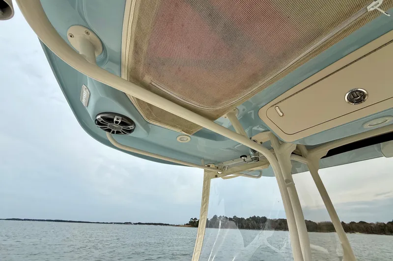 Neverland II Yacht Photos Pics 2022 Grady-White Canyon 271 boat interior, featuring overhead storage and speaker system.