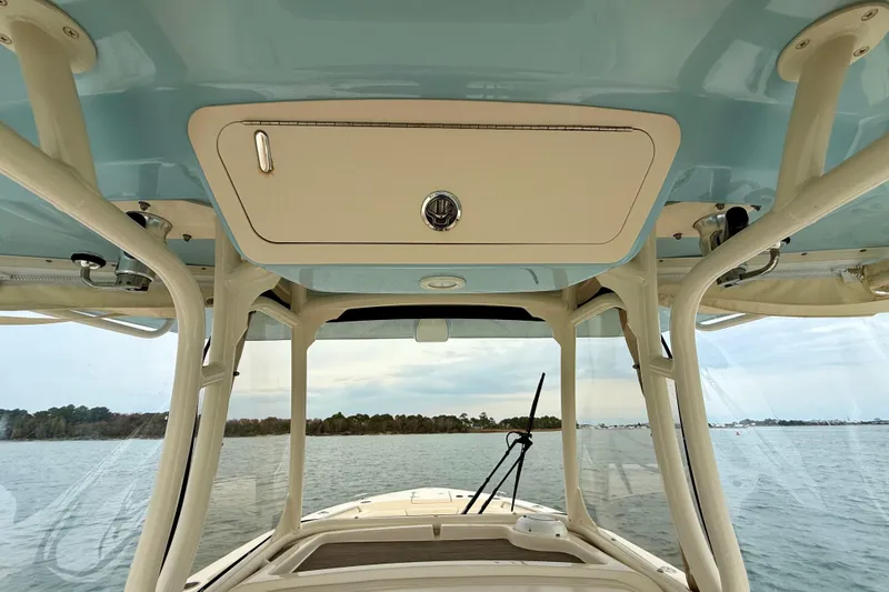 Neverland II Yacht Photos Pics 2022 Grady-White Canyon 271 boat interior with ocean view and overhead storage.