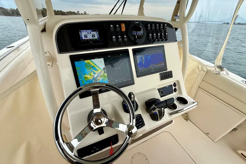 Neverland II Yacht Photos Pics 2022 Grady-White Canyon 271 helm with advanced navigation and control systems.