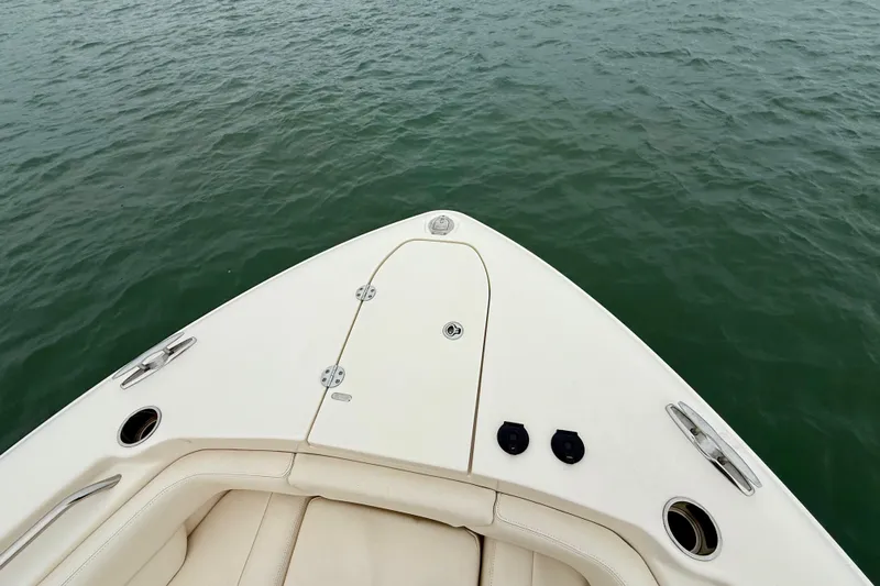 Neverland II Yacht Photos Pics Bow of 2022 Grady-White Canyon 271 boat on calm water.