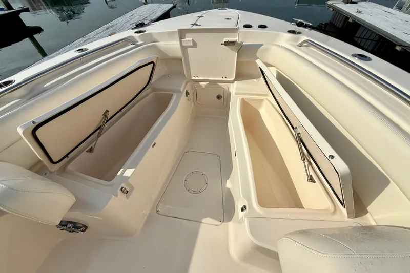 Neverland II Yacht Photos Pics 2022 Grady-White Canyon 271 boat interior with open storage compartments.