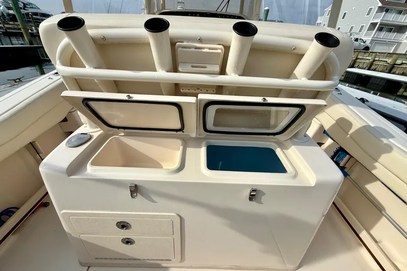 Neverland II Yacht Photos Pics 2022 Grady-White Canyon 271 boat with rod holders and storage compartments.