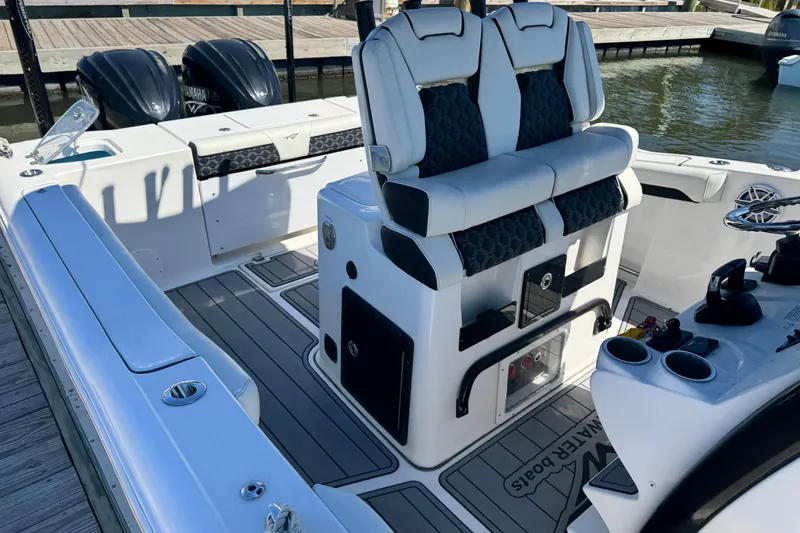  Yacht Photos Pics 2022 Tidewater 280 CC Adventure boat interior with dual seats and twin Yamaha engines.