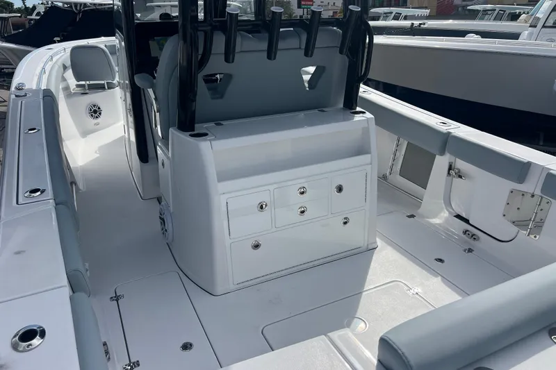  Yacht Photos Pics 2026 Sportsman Open 302 Center Console boat interior with seating and storage compartments.