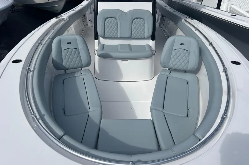  Yacht Photos Pics 2026 Sportsman Open 302 Center Console boat with luxurious seating arrangement.