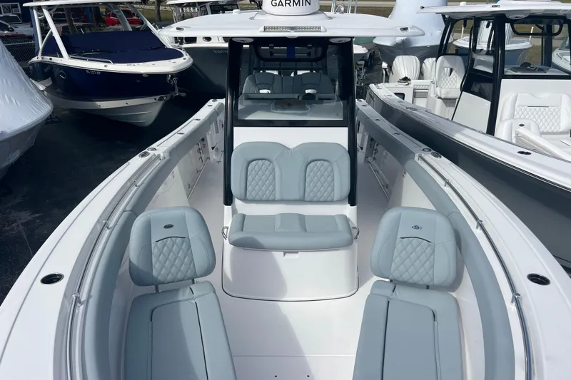  Yacht Photos Pics 2026 Sportsman Open 302 Center Console boat with sleek seating and modern design.