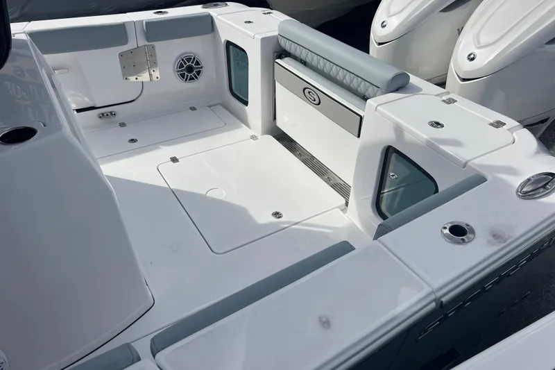  Yacht Photos Pics 2026 Sportsman Open 302 Center Console boat interior with seating and storage compartments.