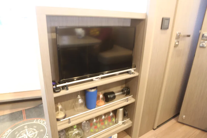 Lucky Lovers Yacht Photos Pics TV and storage shelves across from dinette