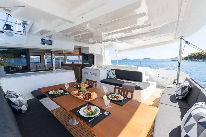 Mare Azul Yacht Photos Pics Luxurious dining area on 2024 Lagoon 46 yacht with ocean view.