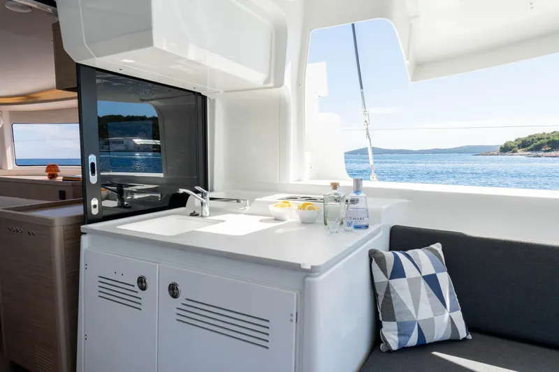 Mare Azul Yacht Photos Pics Modern interior of 2024 Lagoon 46 yacht with ocean view and sleek design.