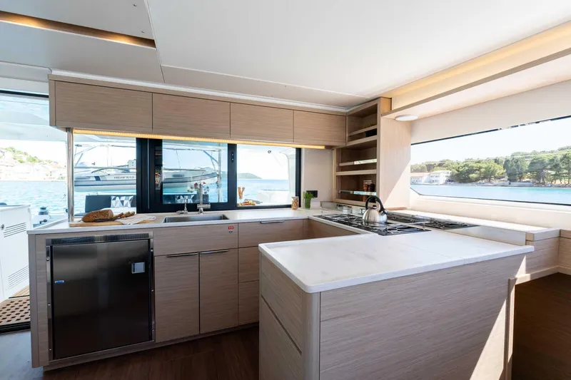 Mare Azul Yacht Photos Pics Modern kitchen interior of 2024 Lagoon 46 yacht with ocean view.