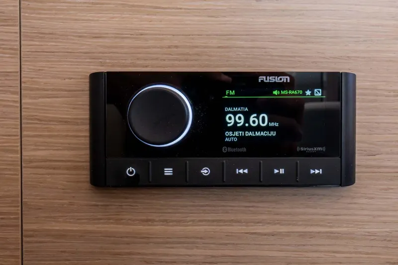 Mare Azul Yacht Photos Pics Fusion radio display on 2024 Lagoon 46 yacht, showing FM station 99.60 MHz.