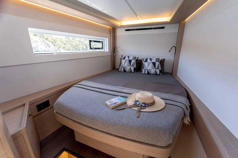 Mare Azul Yacht Photos Pics Luxurious 2024 Lagoon 46 yacht cabin with modern decor and natural light.