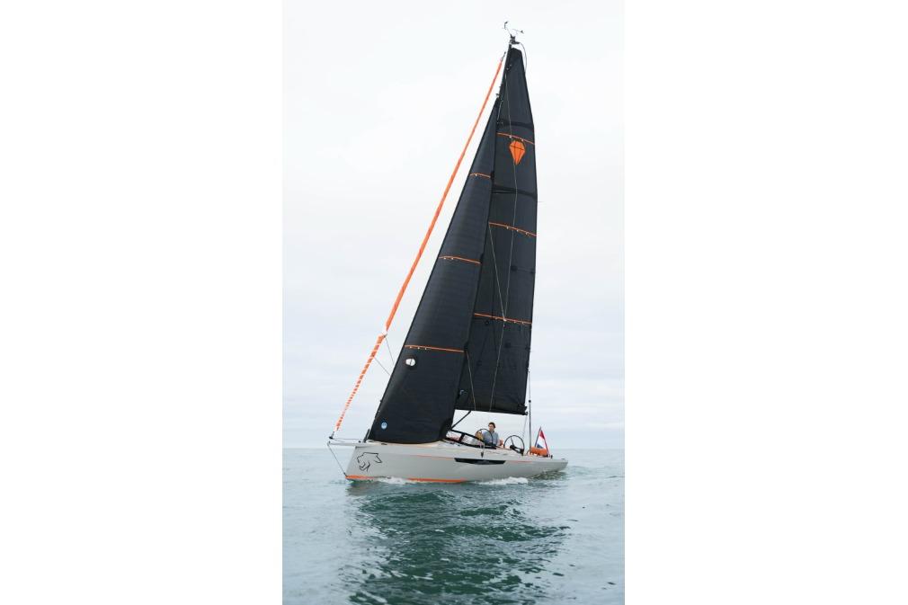 2026 Saffier SE 28 Leopard sailing on calm waters with sleek black sails.