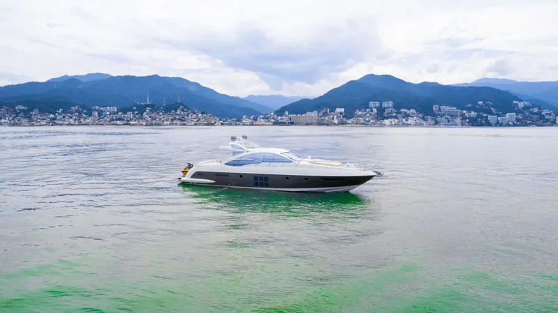 Bala Yacht Photos Pics 2009 Azimut 62S yacht on calm waters with mountain backdrop.