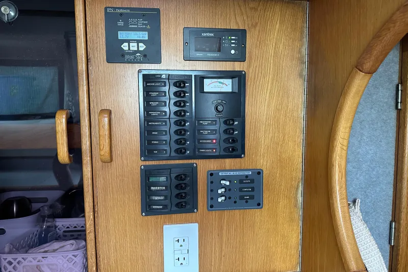 Makani Yacht Photos Pics Control panel of a 2008 Seawind 1000 XL catamaran, featuring various switches and meters.