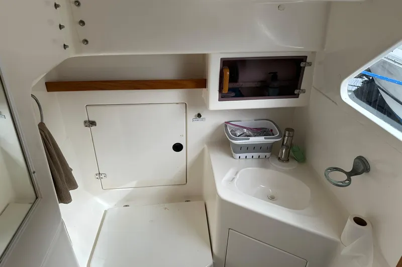 Makani Yacht Photos Pics 2008 Seawind 1000 XL boat interior with sink, storage, and window.