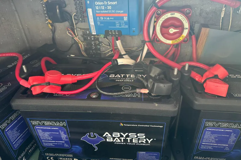 Makani Yacht Photos Pics Battery setup in a 2008 Seawind 1000 XL, featuring Abyss lithium batteries and wiring components.