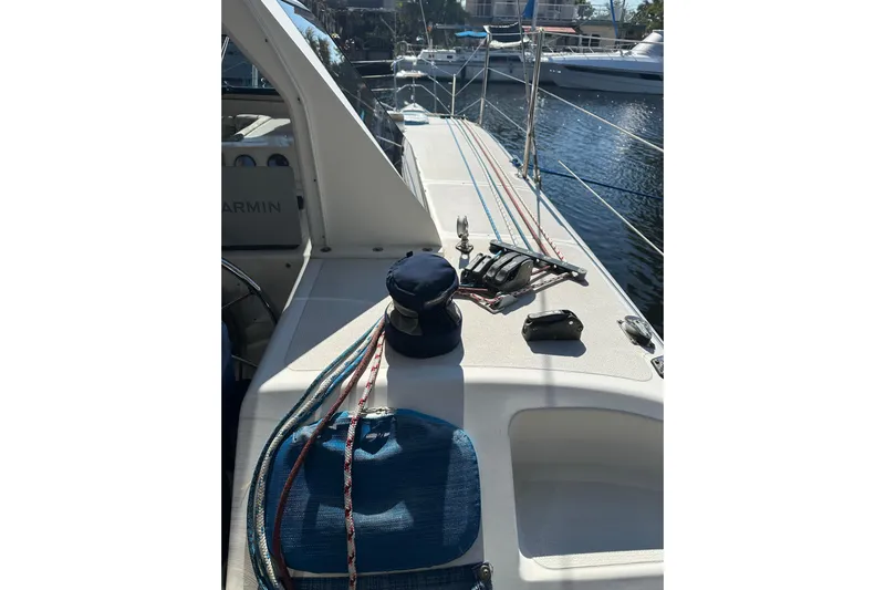 Makani Yacht Photos Pics 2008 Seawind 1000 XL catamaran deck with ropes and winch, docked in marina.