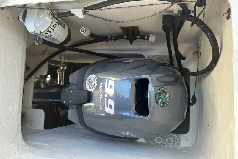 Makani Yacht Photos Pics Outboard motor in a 2008 Seawind 1000 XL catamaran engine compartment.