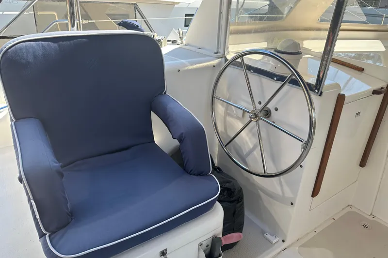 Makani Yacht Photos Pics Captain's chair and steering wheel on 2008 Seawind 1000 XL catamaran.