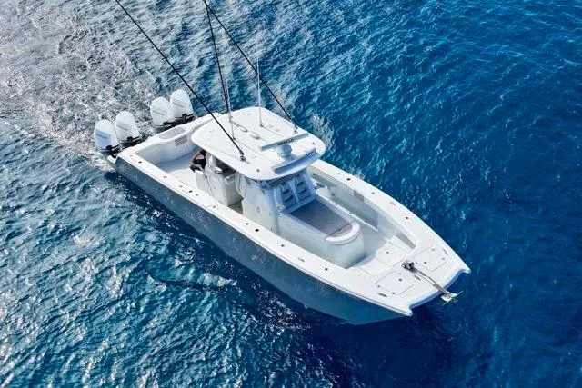  Yacht Photos Pics Freeman 37 VH 2022 boat cruising on clear blue ocean waters.