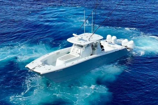  Yacht Photos Pics 2022 Freeman 37 VH boat cruising in vibrant blue ocean waters.