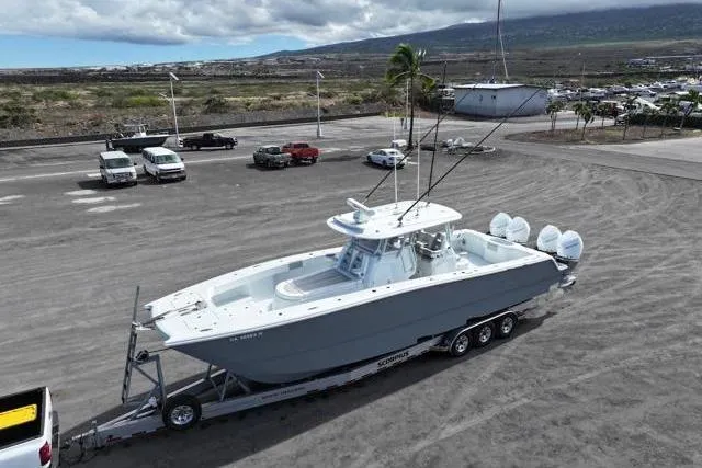  Yacht Photos Pics 2022 Freeman 37 VH boat on trailer in parking lot, ready for transport.