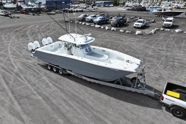 Yacht Photos Pics 2022 Freeman 37 VH boat on trailer in parking lot, aerial view.