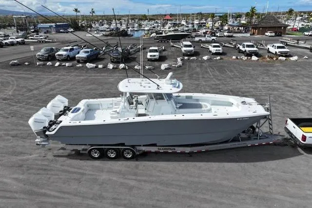  Yacht Photos Pics 2022 Freeman 37 VH boat on trailer in marina parking lot.