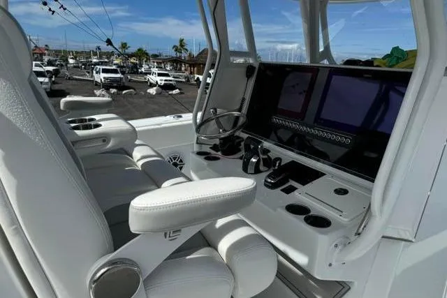  Yacht Photos Pics 2022 Freeman 37 VH boat cockpit with modern controls and white seating.