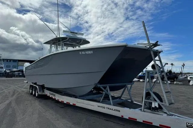  Yacht Photos Pics 2022 Freeman 37 VH boat on Myco trailer under cloudy sky.