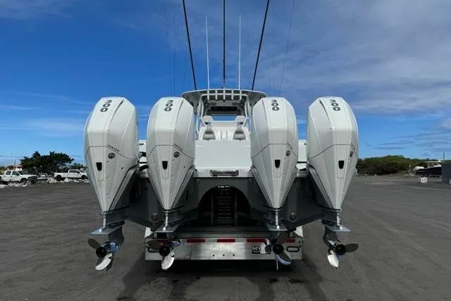  Yacht Photos Pics 2022 Freeman 37 VH boat with four powerful outboard engines, parked on a trailer.