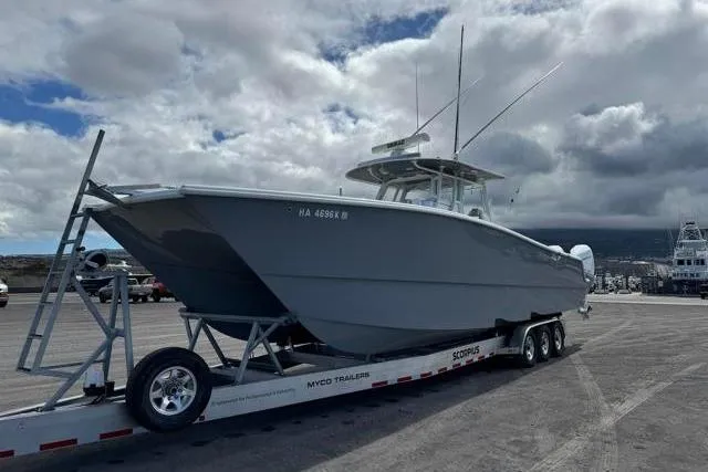  Yacht Photos Pics 2022 Freeman 37 VH boat on trailer under cloudy sky.