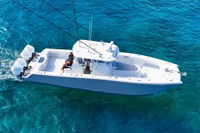  Yacht Photos Pics 2022 Freeman 37 VH boat cruising on clear blue ocean waters.