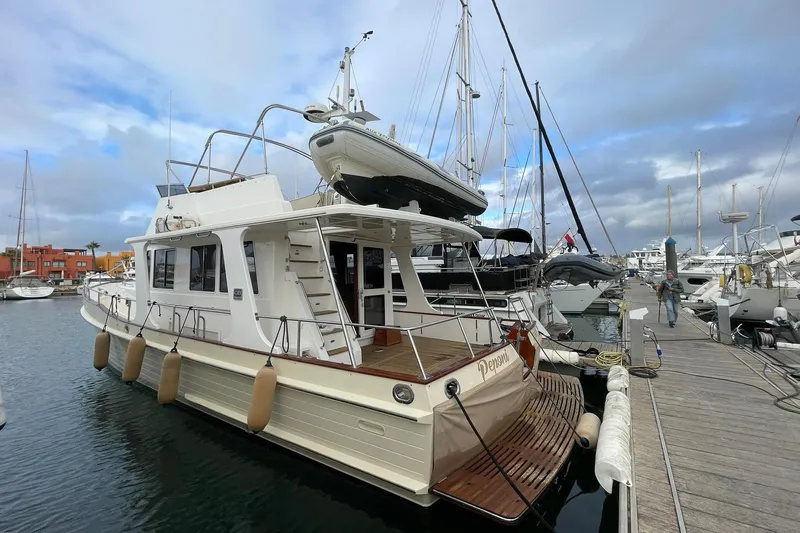 Peponi II Yacht Photos Pics 2008 Grand Banks 47 Heritage EU yacht docked at marina, featuring classic design and spacious deck.