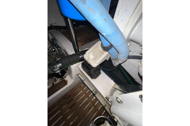 Peponi II Yacht Photos Pics Engine compartment of 2008 Grand Banks 47 Heritage EU with visible hoses and components.